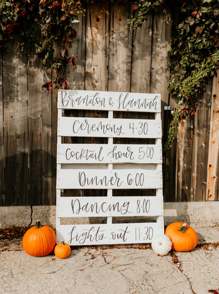 wood pallet sign with pumpkins, Illinois wedding venues 