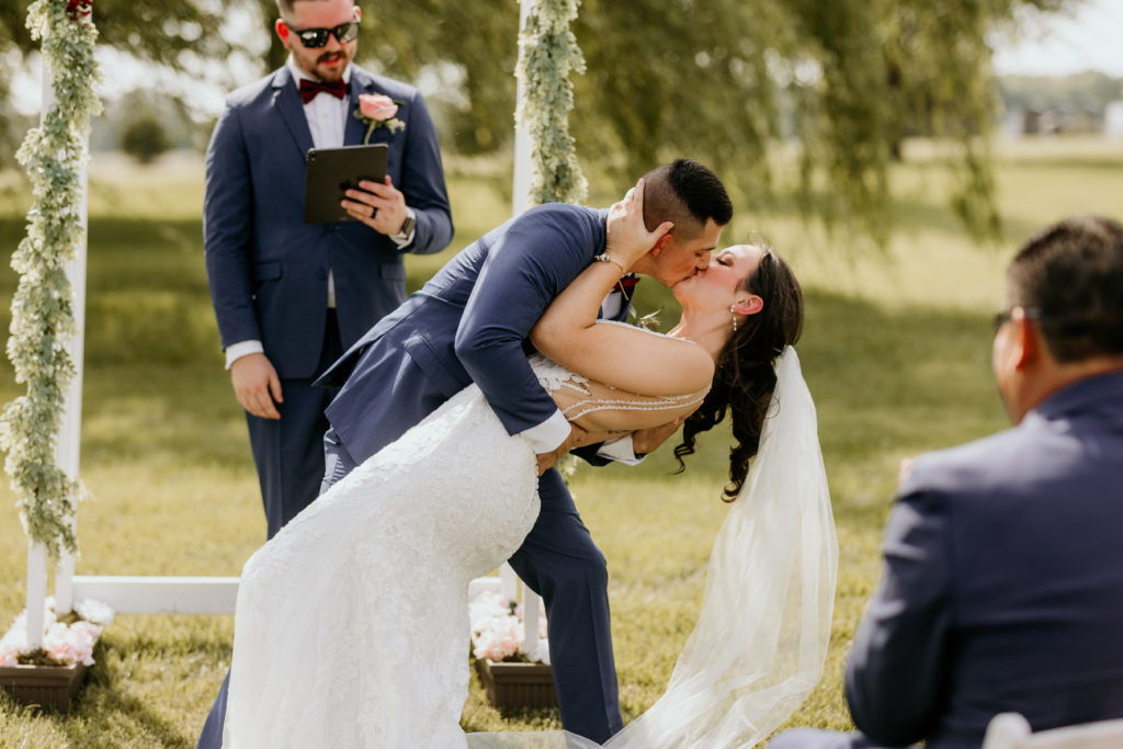 Bride and groom first kiss, Missouri wedding photographer