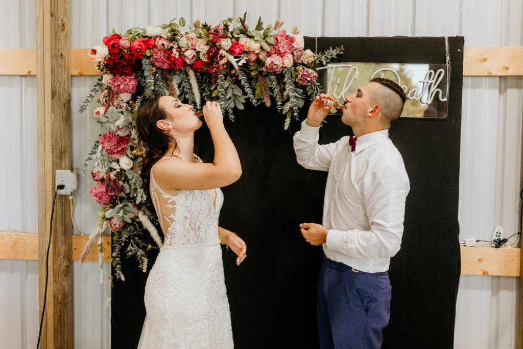 Wedding toast, Bride and groom take shots, Missouri wedding photographer