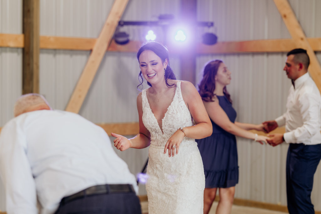 Bride dancing at wedding reception, Missouri wedding photographer