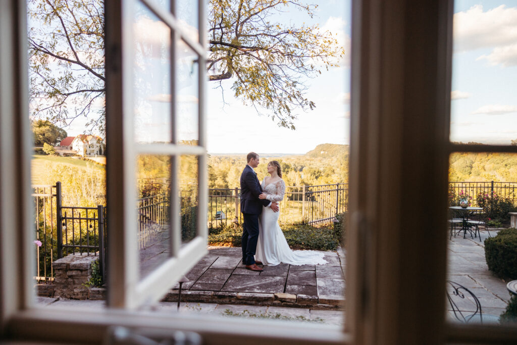 bride and groom embrace at The Inns at St. Albans