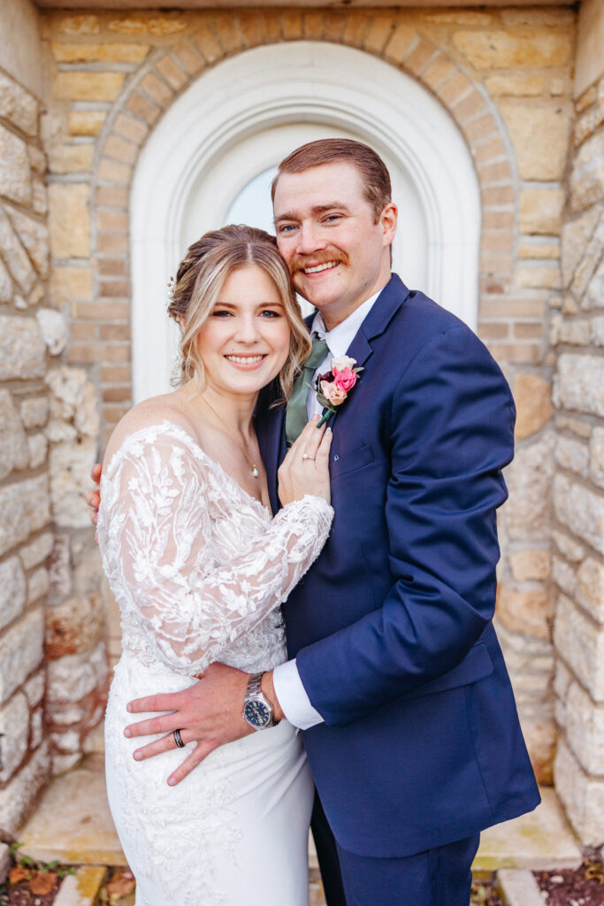 bride and groom embrace at The Inns at St. Albans