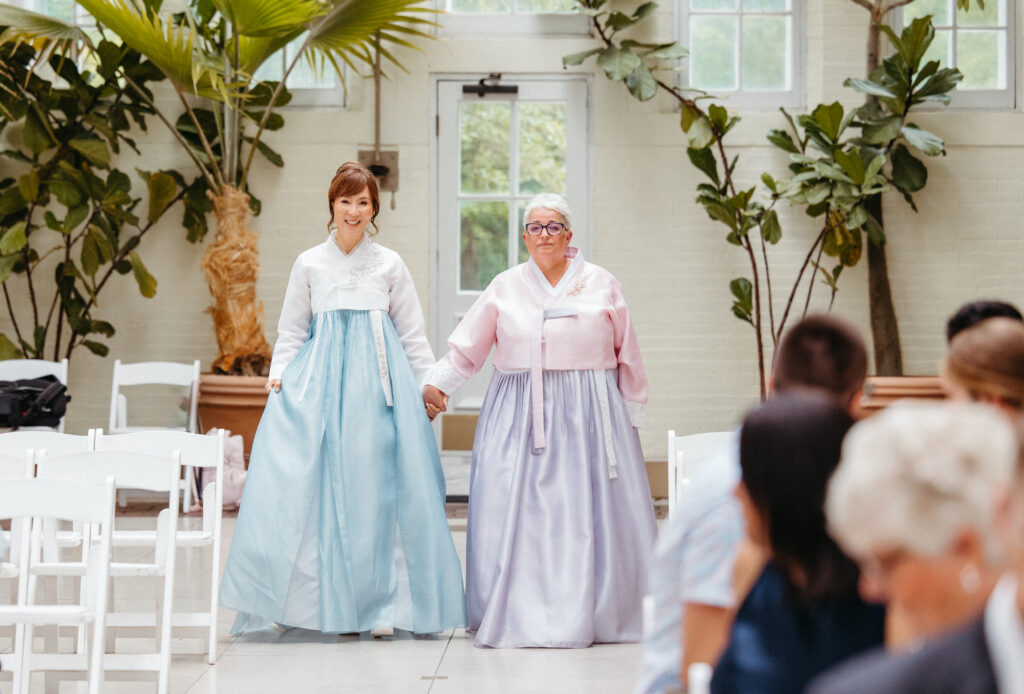 mothers walking down aisle wedding ceremony Piper Palm House wedding Tower Grove St. Louis