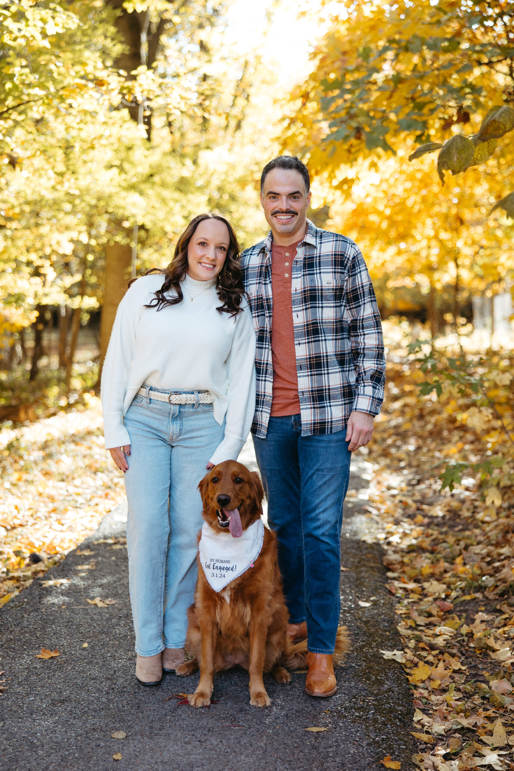St. Louis wedding photographer with engaged couple in fall Forest Park
