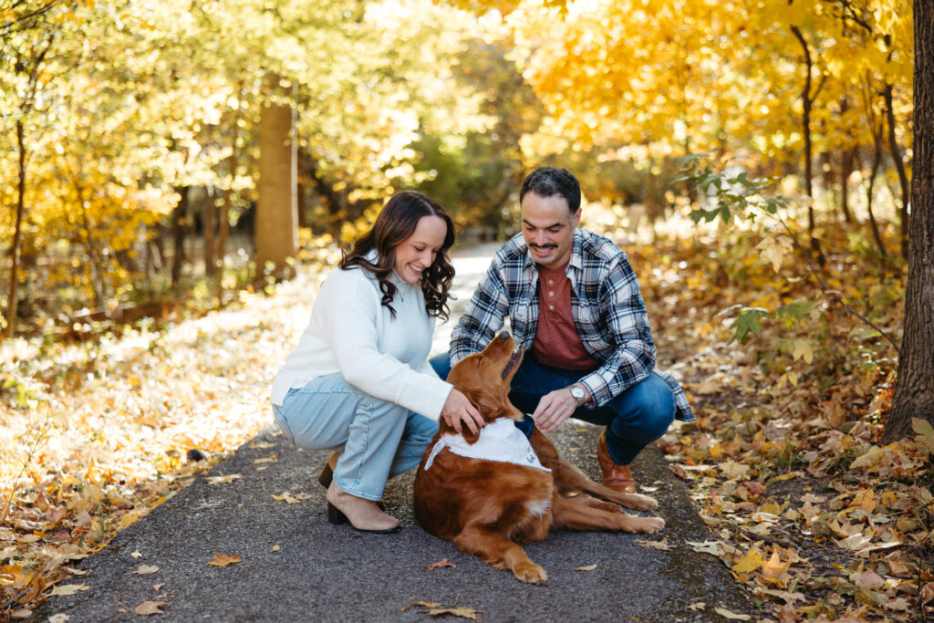 St. Louis wedding photographer with engaged couple in fall Forest Park