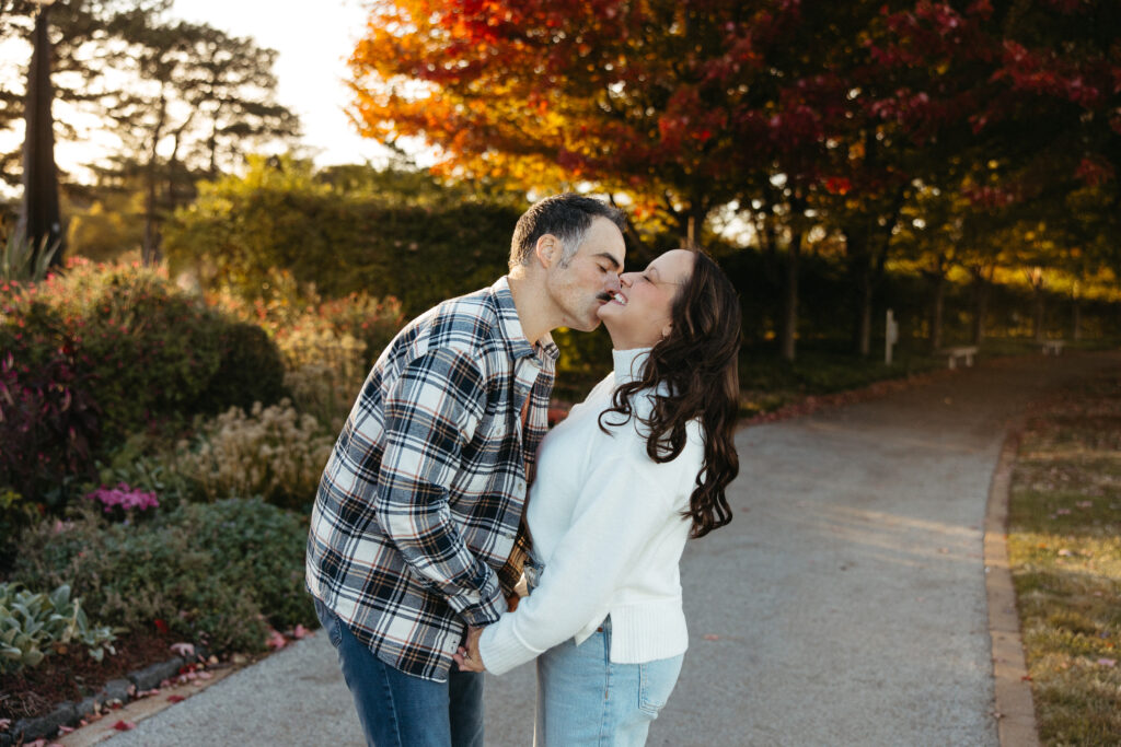 St. Louis wedding photographer with engaged couple in fall Forest Park