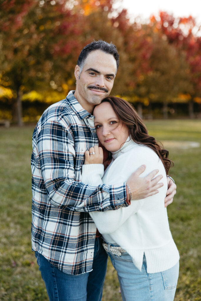 St. Louis wedding photographer with engaged couple in fall Forest Park