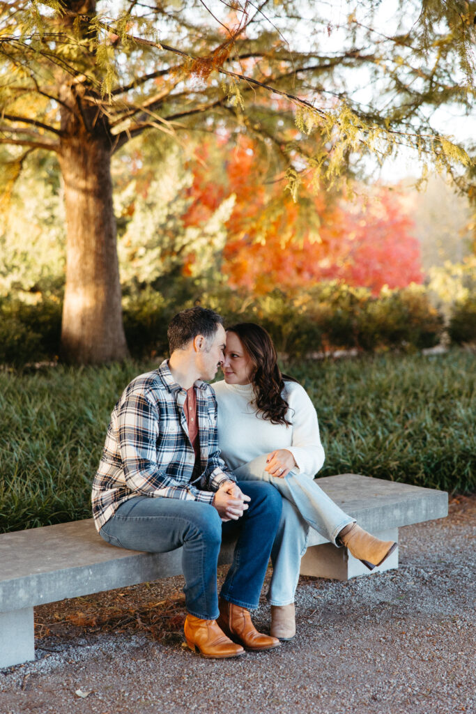 St. Louis wedding photographer with engaged couple in fall Forest Park
