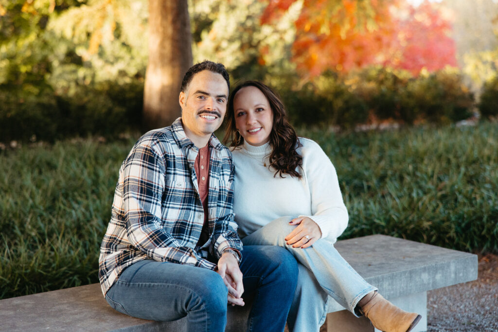 St. Louis wedding photographer with engaged couple in fall Forest Park