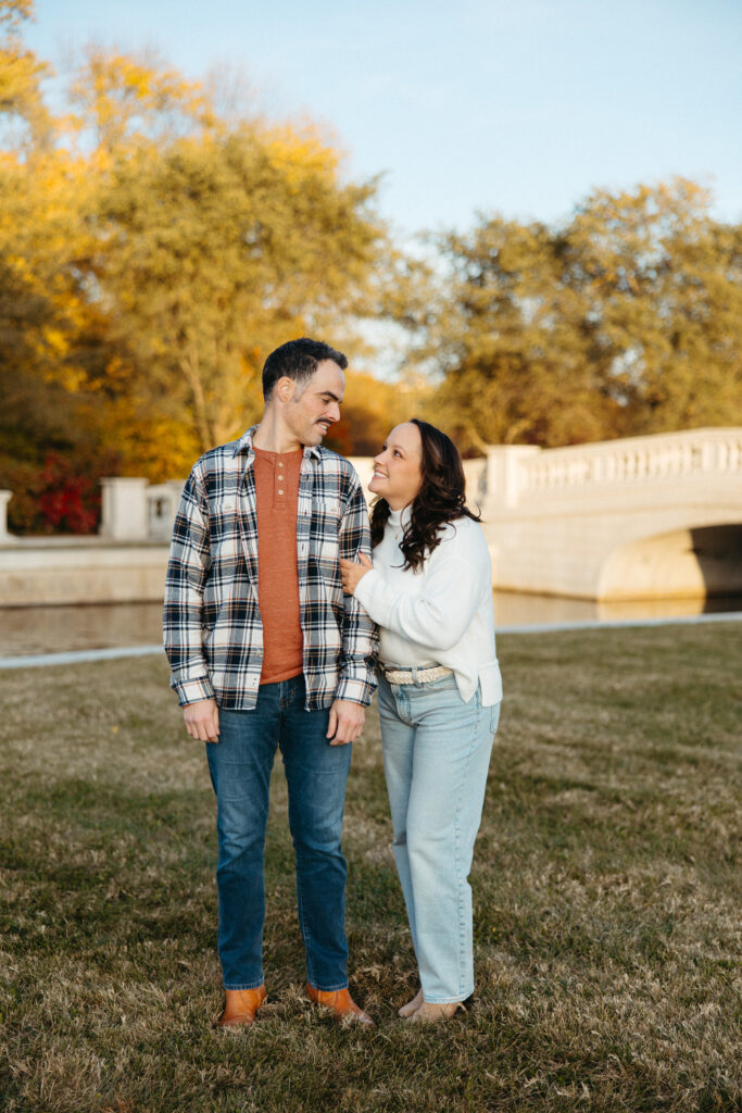 St. Louis wedding photographer with engaged couple in fall Forest Park