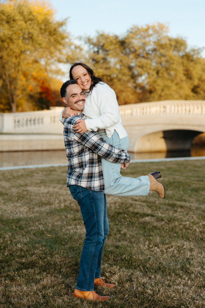 St. Louis wedding photographer with engaged couple in fall Forest Park