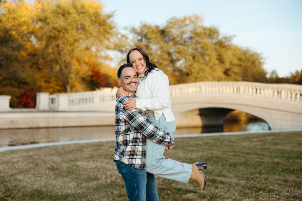 St. Louis wedding photographer with engaged couple in fall Forest Park