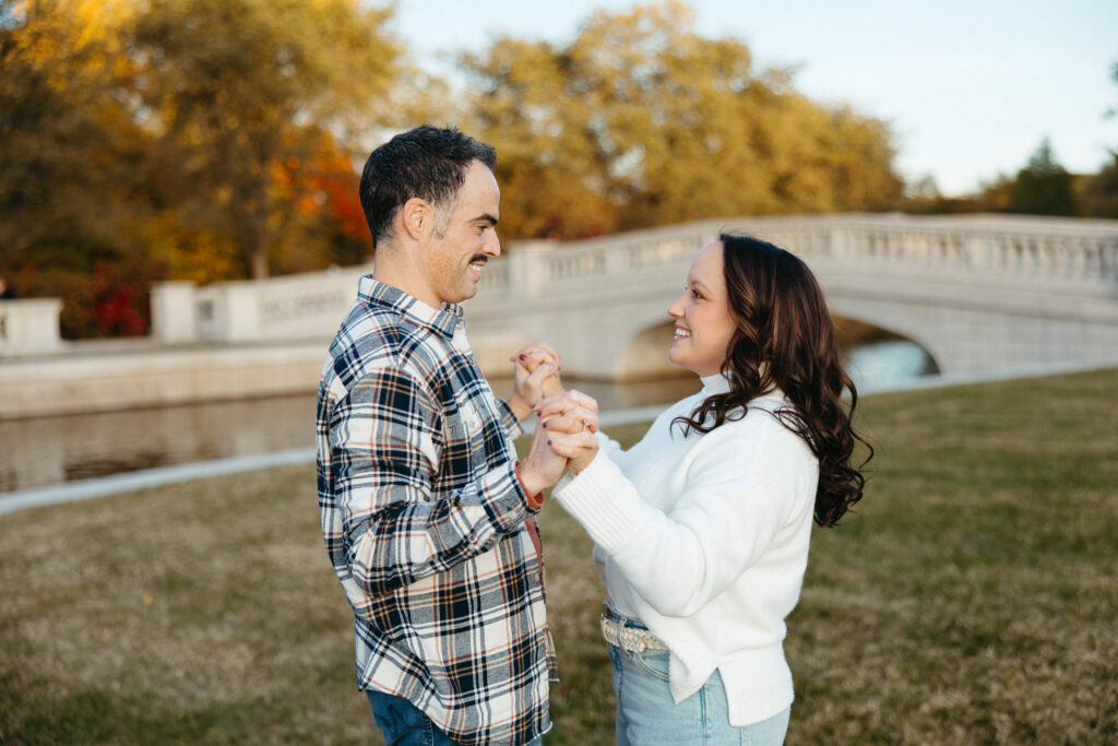 St. Louis wedding photographer with engaged couple in fall Forest Park