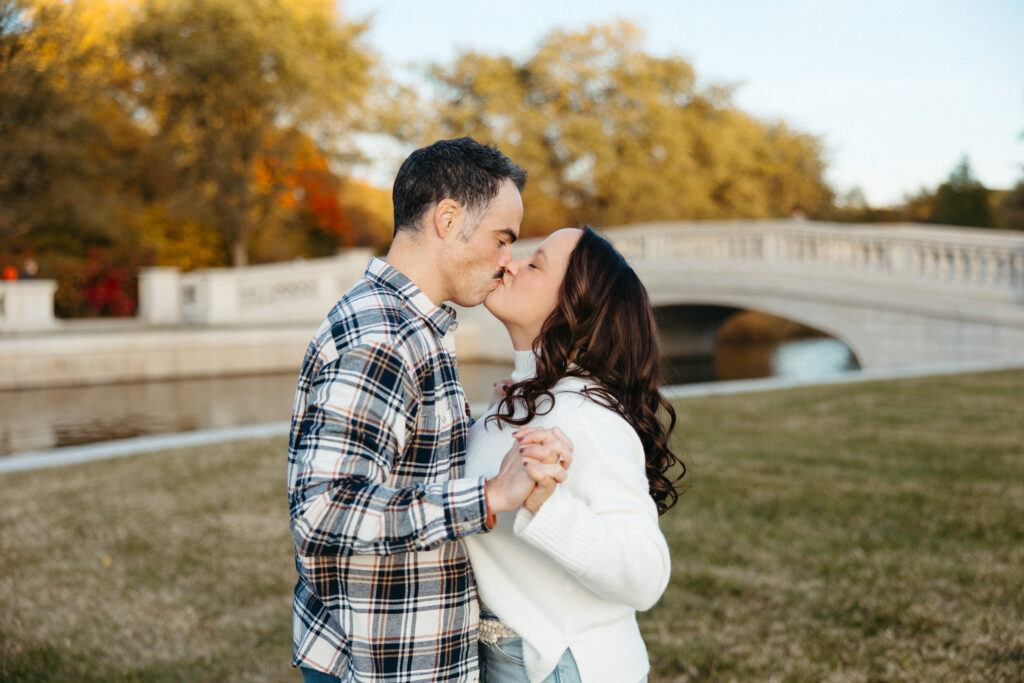St. Louis wedding photographer with engaged couple in fall Forest Park