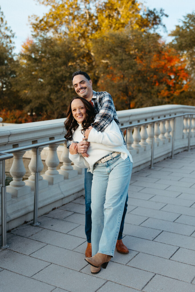 St. Louis wedding photographer with engaged couple in fall Forest Park