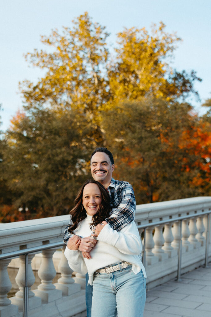 St. Louis wedding photographer with engaged couple in fall Forest Park