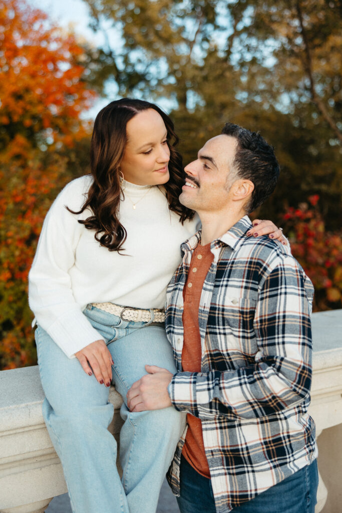 St. Louis wedding photographer with engaged couple in fall Forest Park