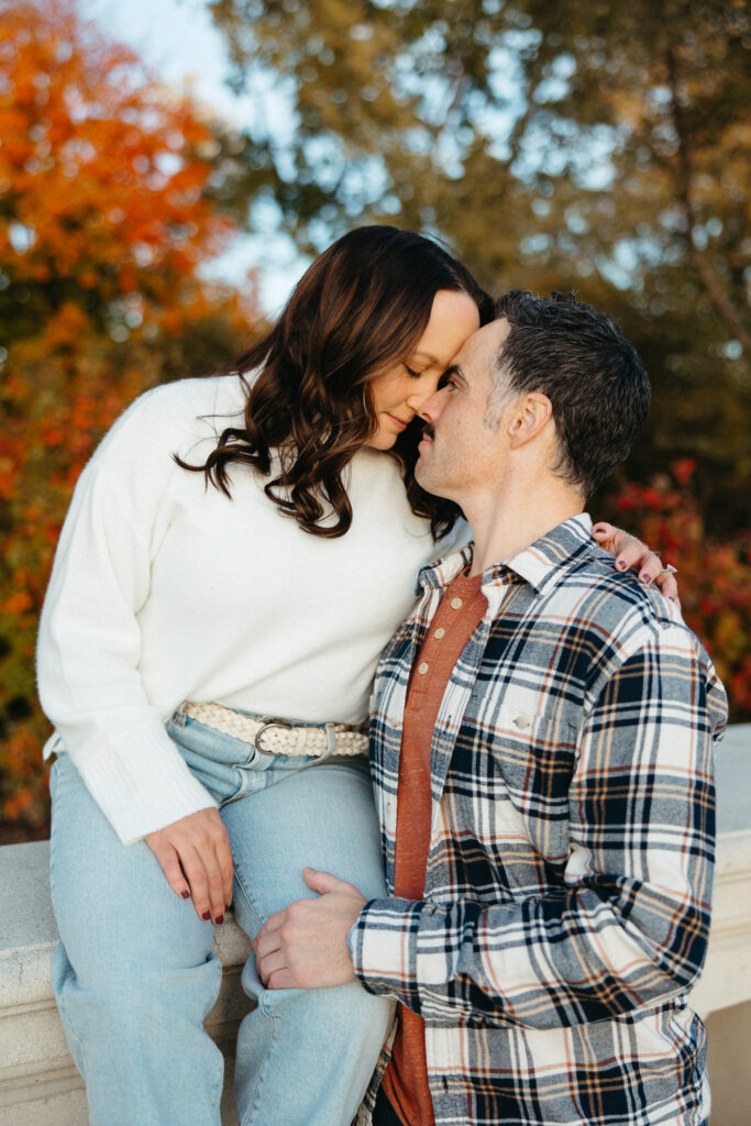 St. Louis wedding photographer with engaged couple in fall Forest Park