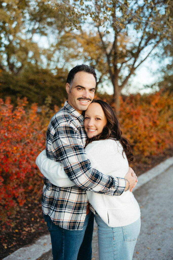 St. Louis wedding photographer with engaged couple in fall Forest Park