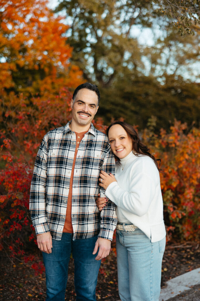 St. Louis wedding photographer with engaged couple in fall Forest Park