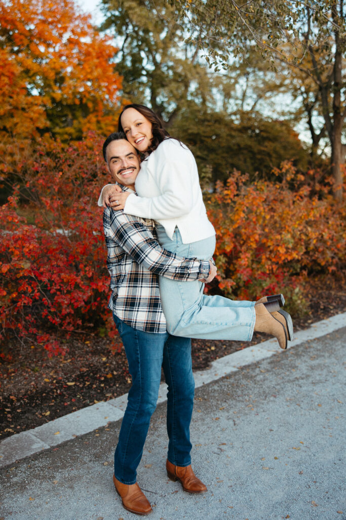 St. Louis wedding photographer with engaged couple in fall Forest Park