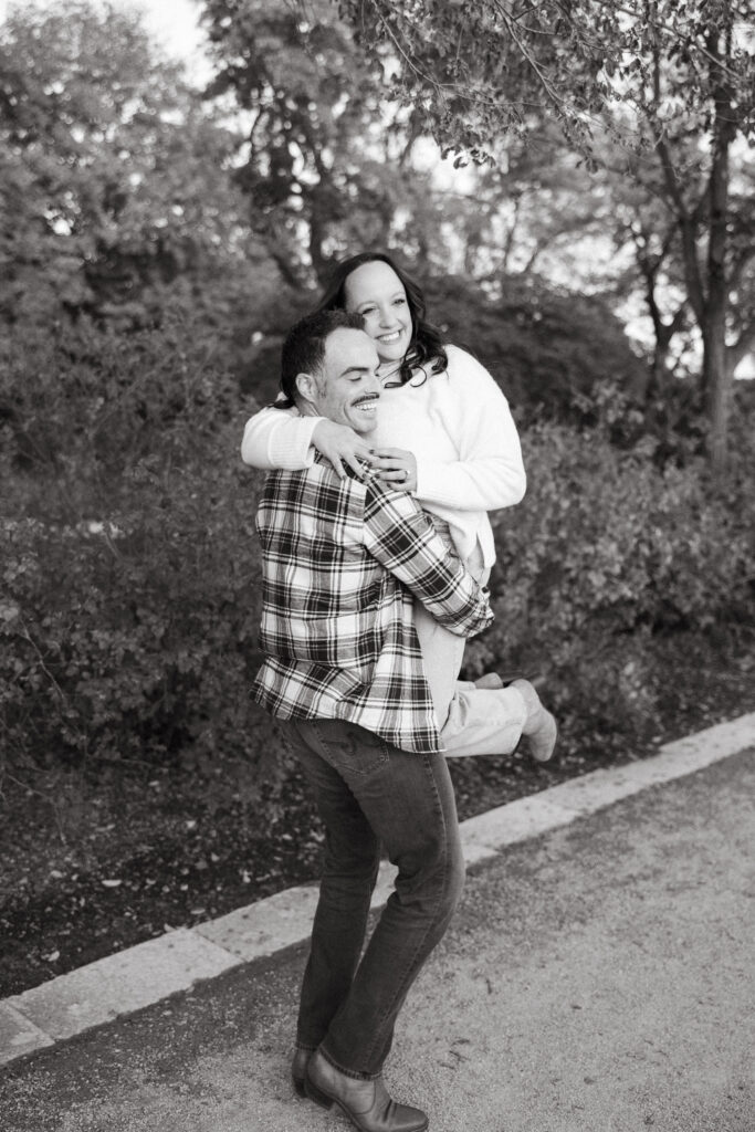 St. Louis wedding photographer with engaged couple in fall Forest Park