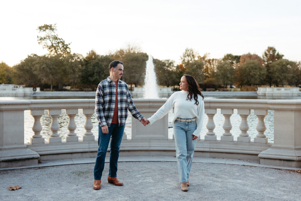 St. Louis wedding photographer with engaged couple in fall Forest Park