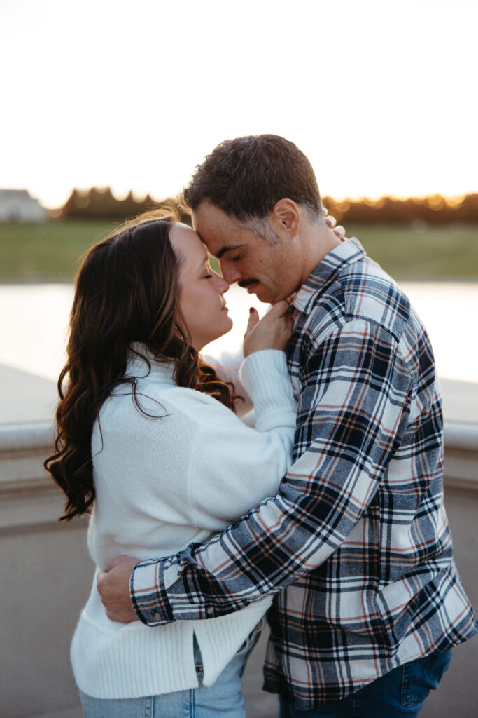 St. Louis wedding photographer with engaged couple in fall Forest Park