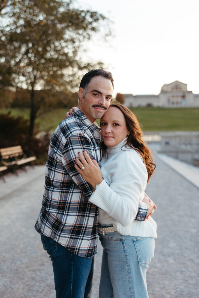St. Louis wedding photographer with engaged couple in fall Forest Park